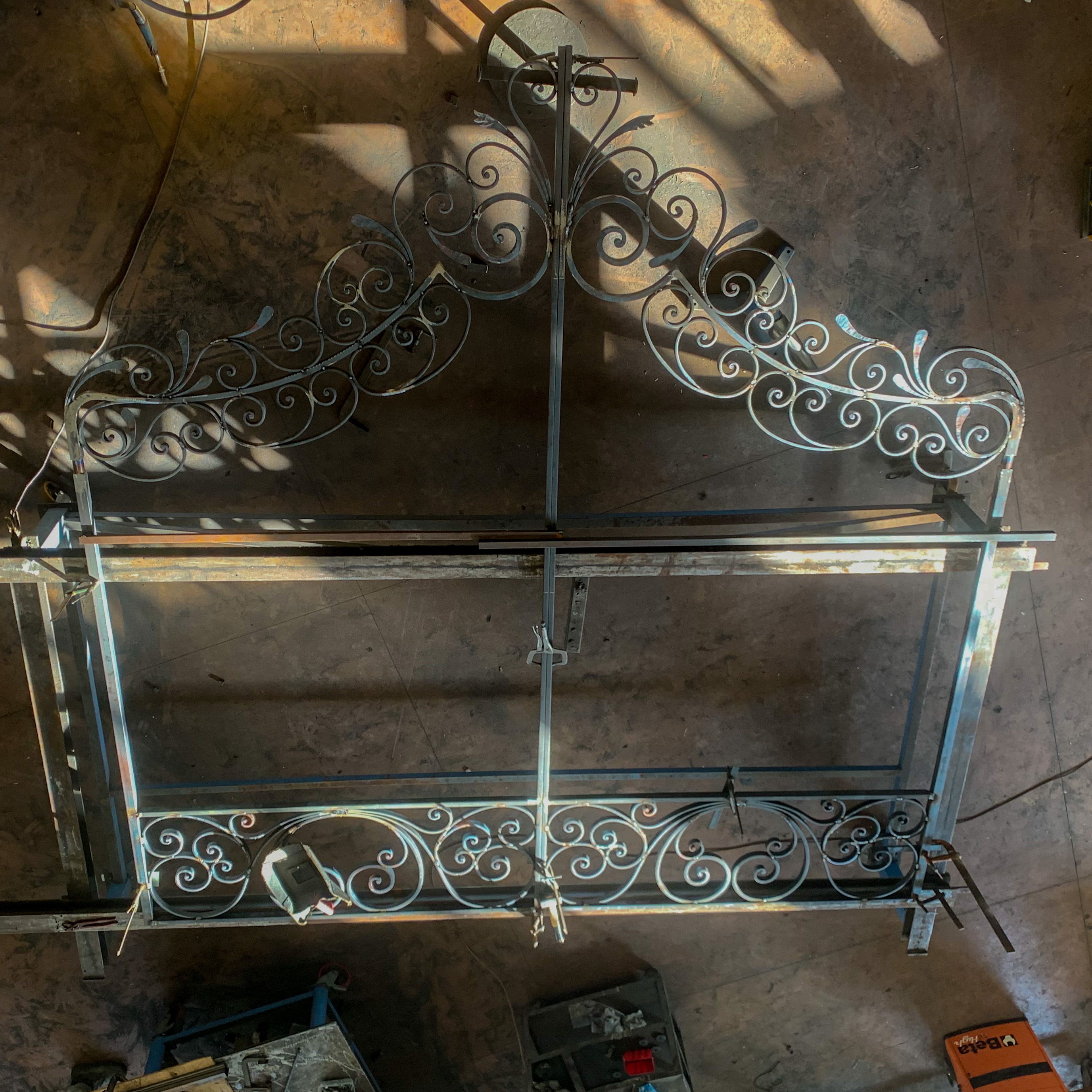 Handcrafted wrought iron gate with decorative hexagonal geometric patterns