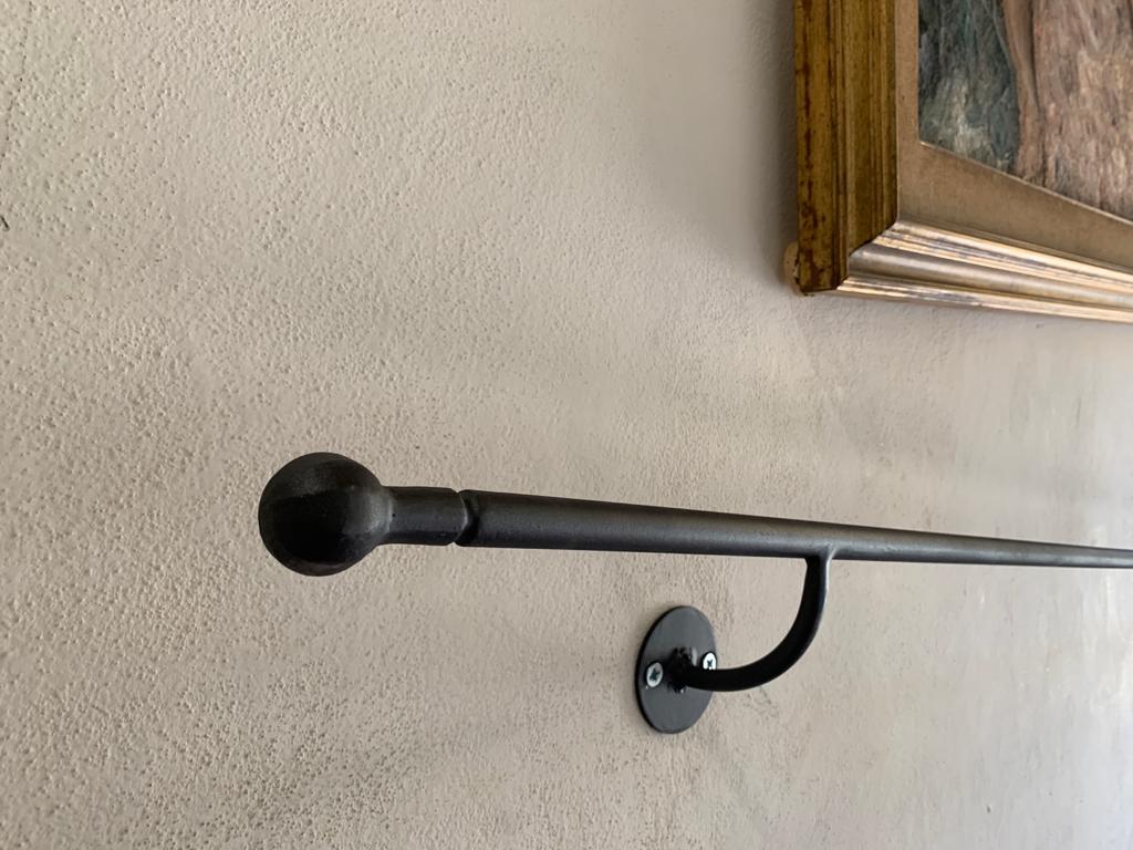 Minimalist black wall-mounted handrail