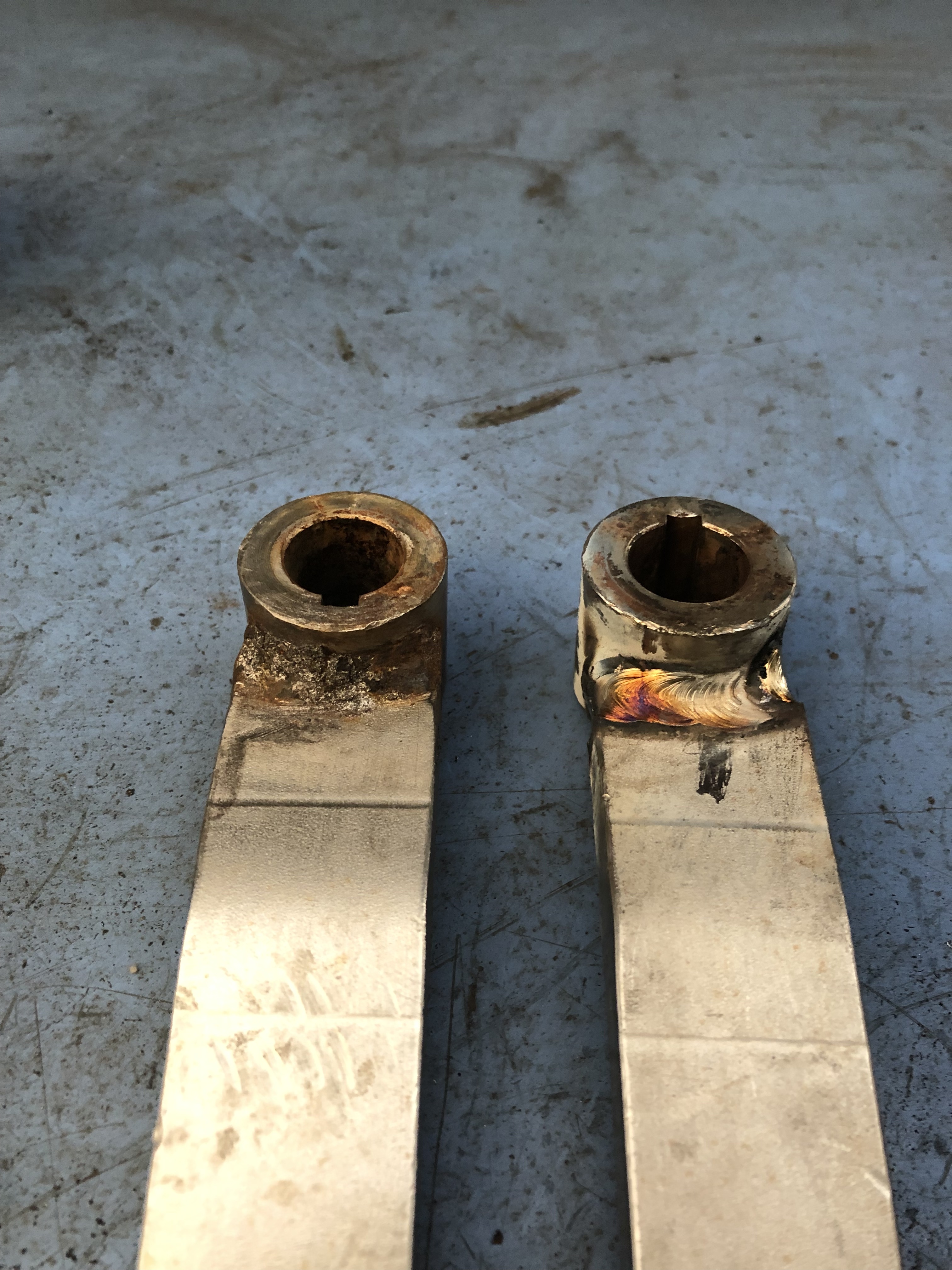 Welded metal brackets showing expert repair work on structural components