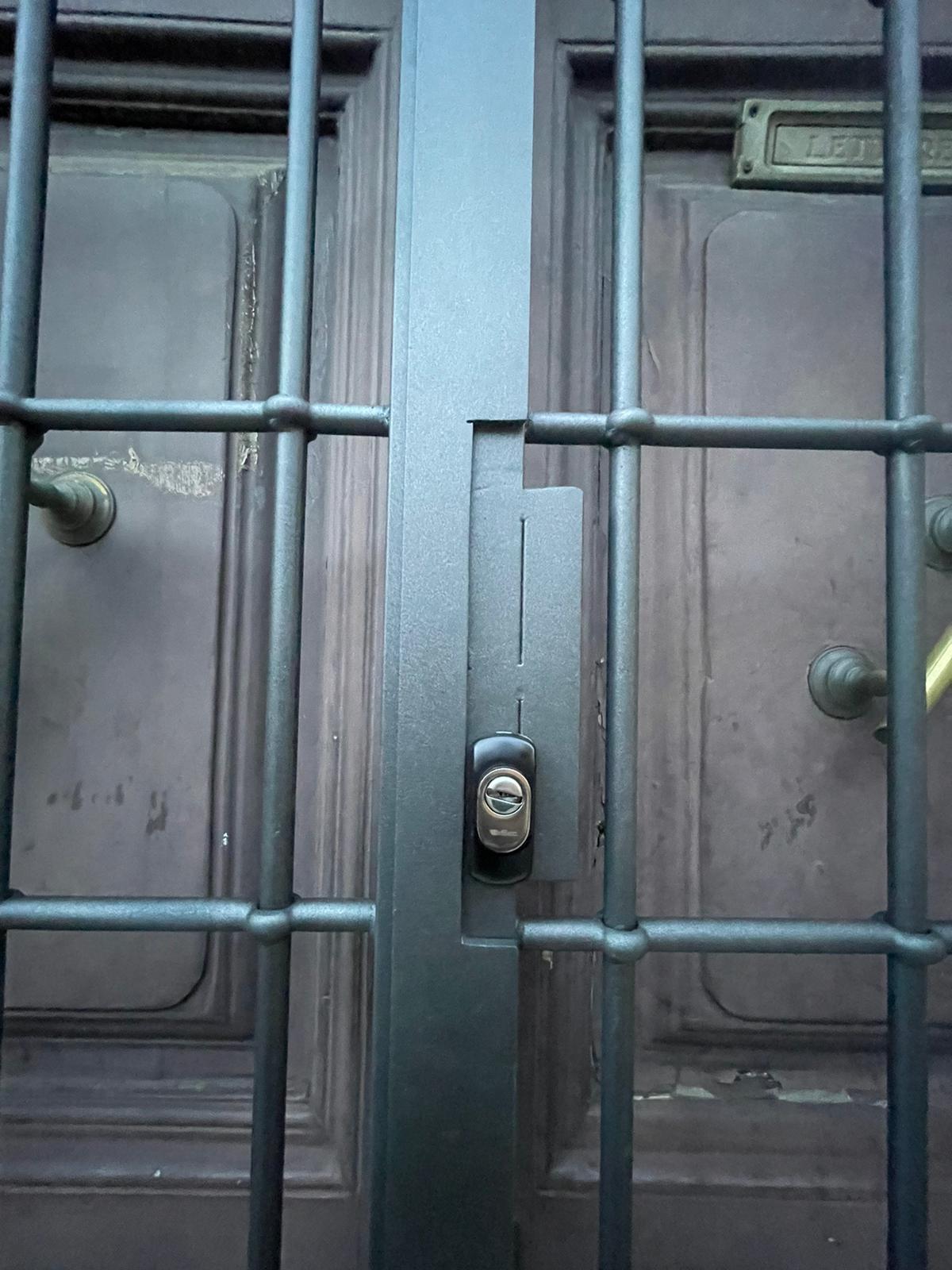 Security gate with decorative iron work
